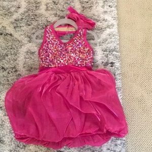 Sparkly pink dance dress with pink bow for hair